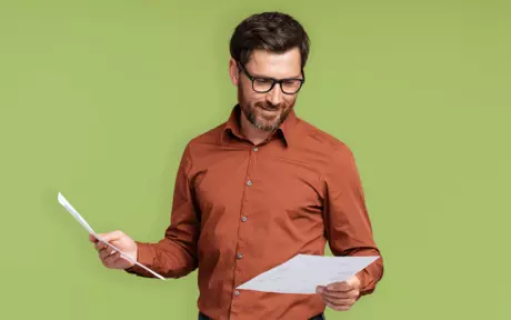 men checking paper